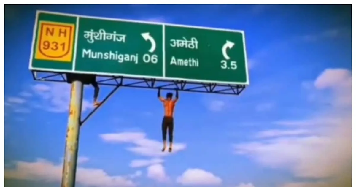 man-climbs-a-20-feet-high-signboard-in-amethi-and-pull-up_1200x630xt.jpg