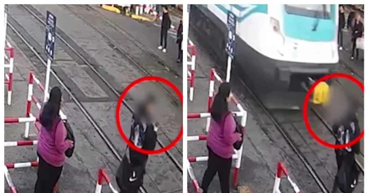 man-engrossed-on-phone-while-crossing-railway-track_1200x630xt.jpg