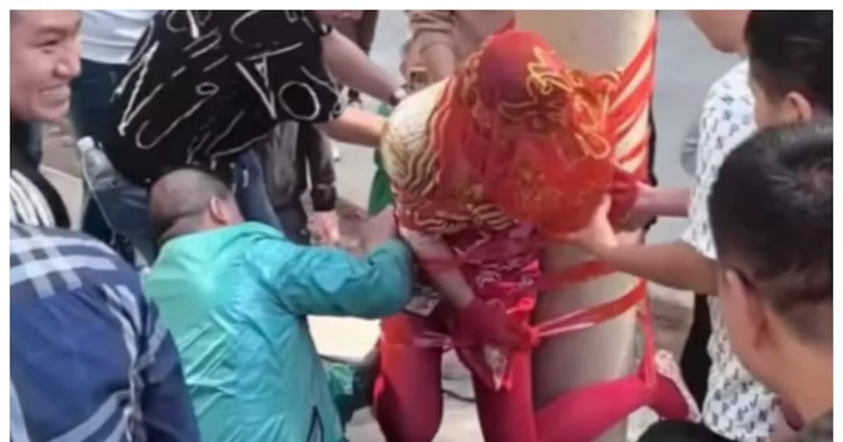 men-using-tape-to-tie-a-woman-to-a-pole_1200x630xt.jpg