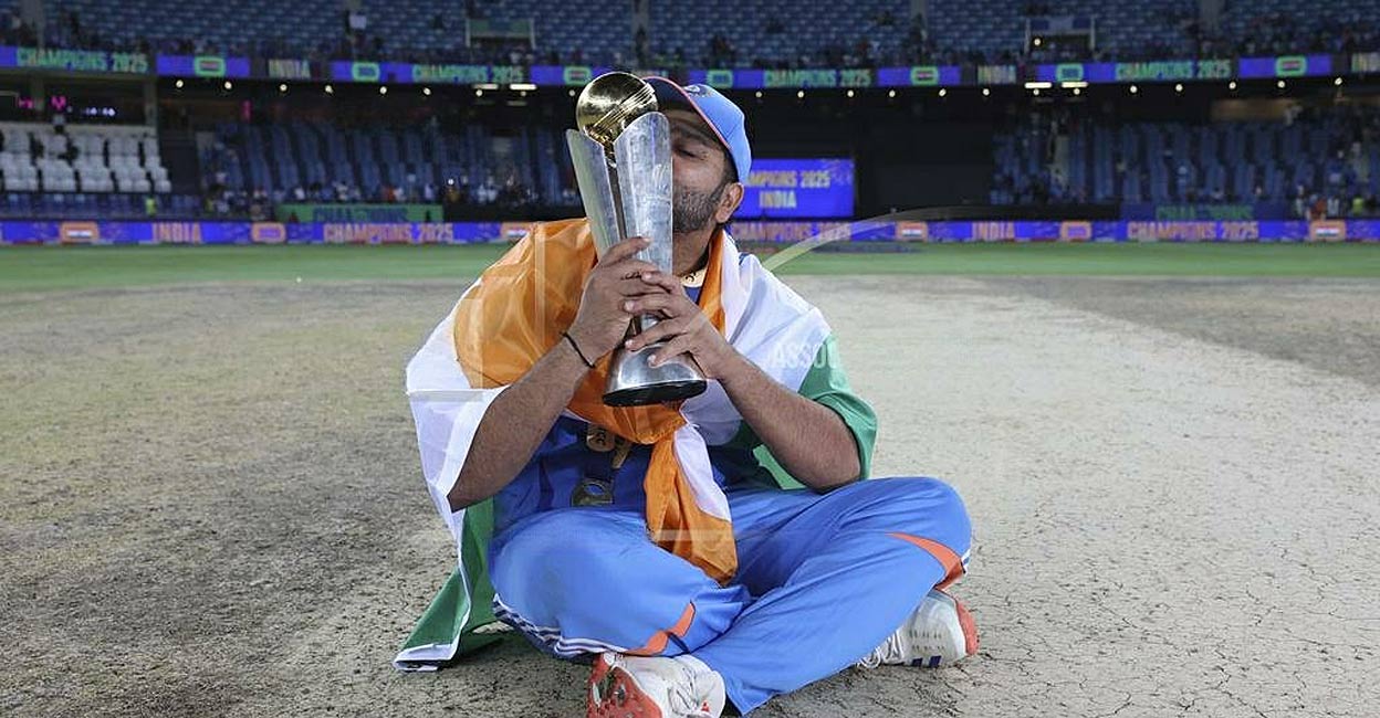 rohit-sharma-with-champions-trophy.jpg