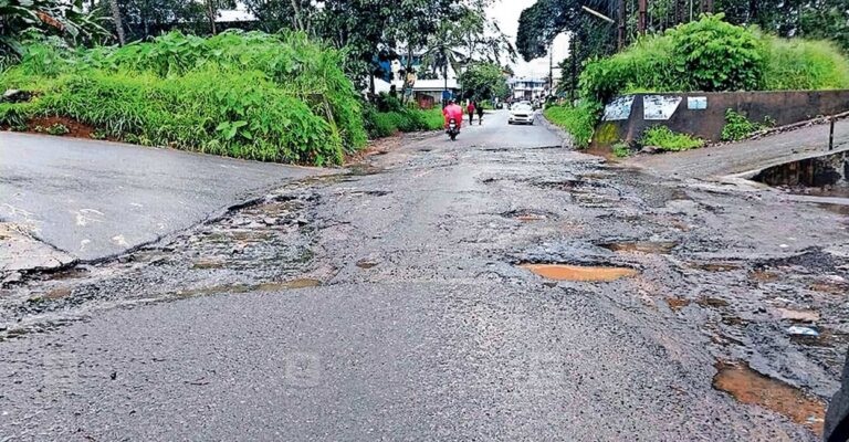 poopany-road-potholes-1.jpg