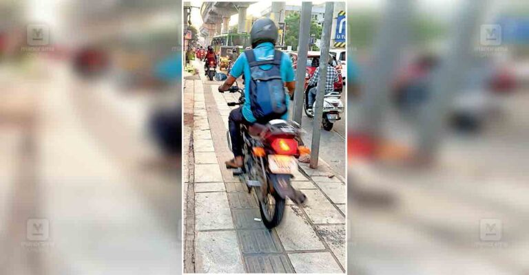 ernakulam-two-wheeler-driving-on-footpath.jpg