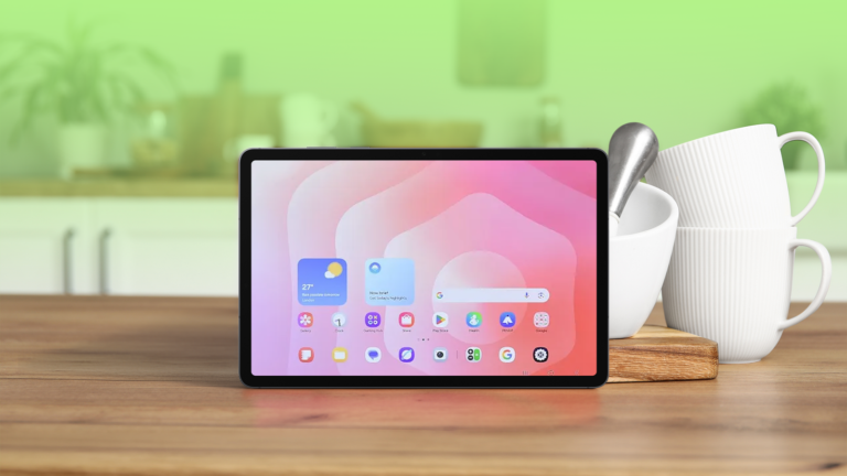 an-android-tablet-on-a-wooden-kitchen-counter-next-to-white-ceramic-cups-and-a-pestle-and-mortar.png