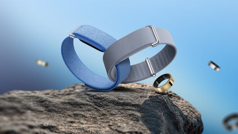 blue-and-gray-fitbit-air-bands-with-galaxy-rings-on-a-rocky-surface.jpg