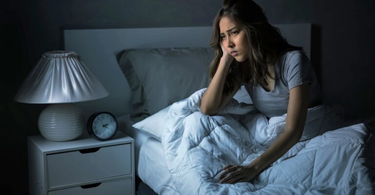 sad-woman-sleep-night-amenic181-istockphoto.jpg
