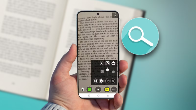 hand-holding-a-smartphone-using-wezoom-to-magnify-text-from-a-book.png